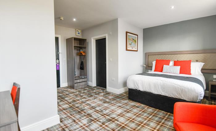 Boutique bedroom with sea view at the Belmont Hotel.